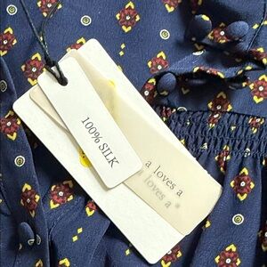 100% silk Size small. NWT. Elegant Navy Floral Women's Blouse